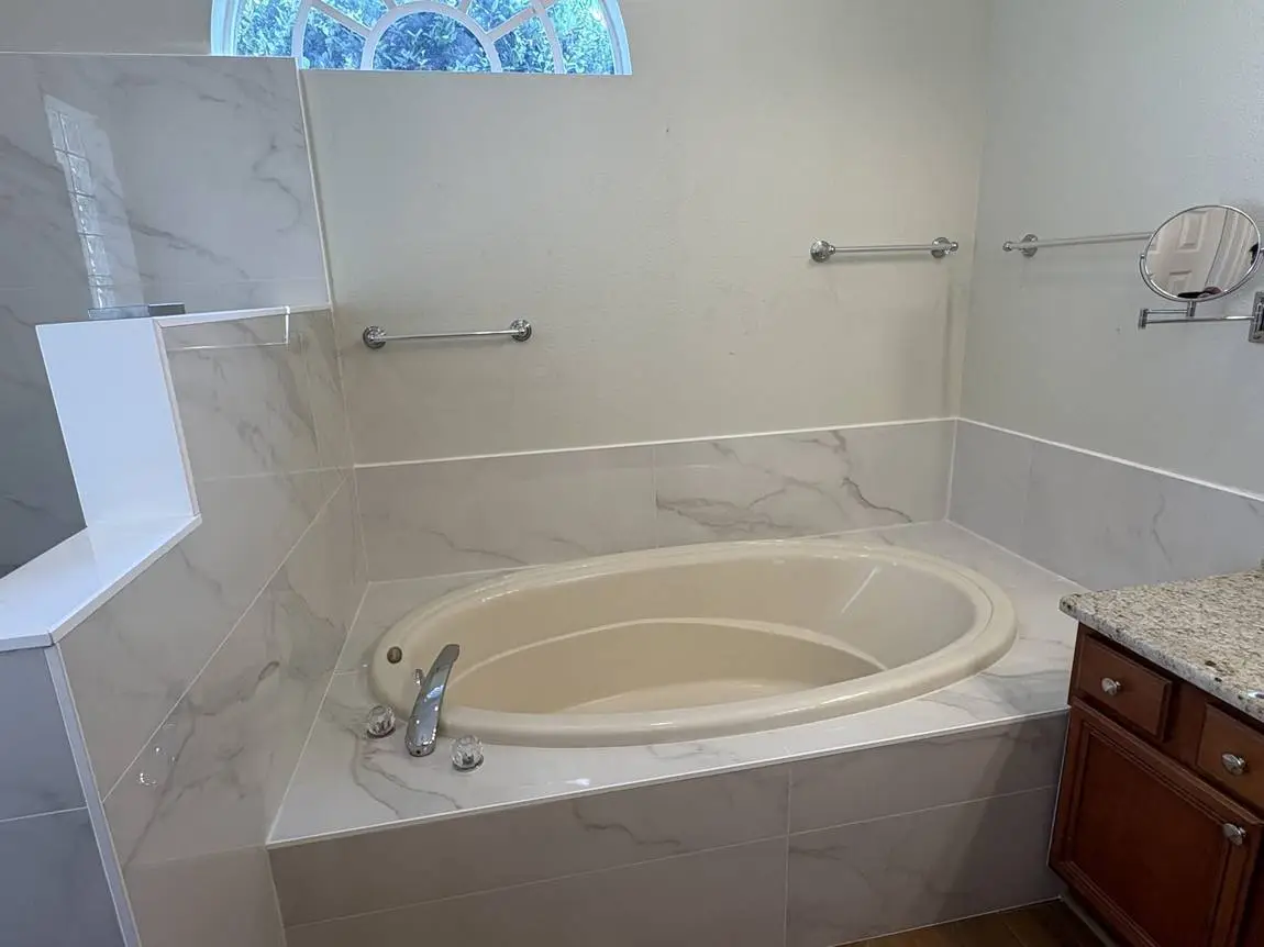 Garden tub deck and skirt tiled in marble-look porcelain, Brandon FL master bathroom