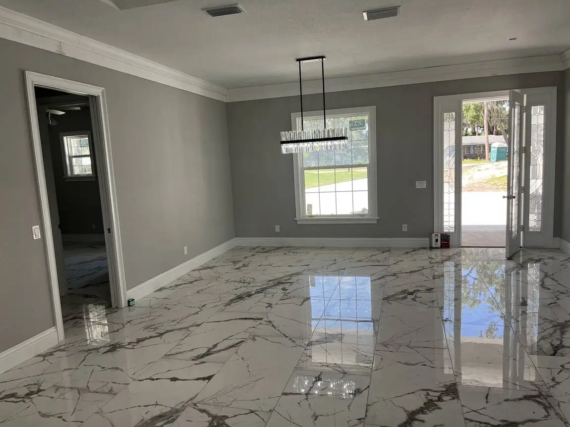 Polished marble-look porcelain floor tile in a Lakeland FL living and dining room